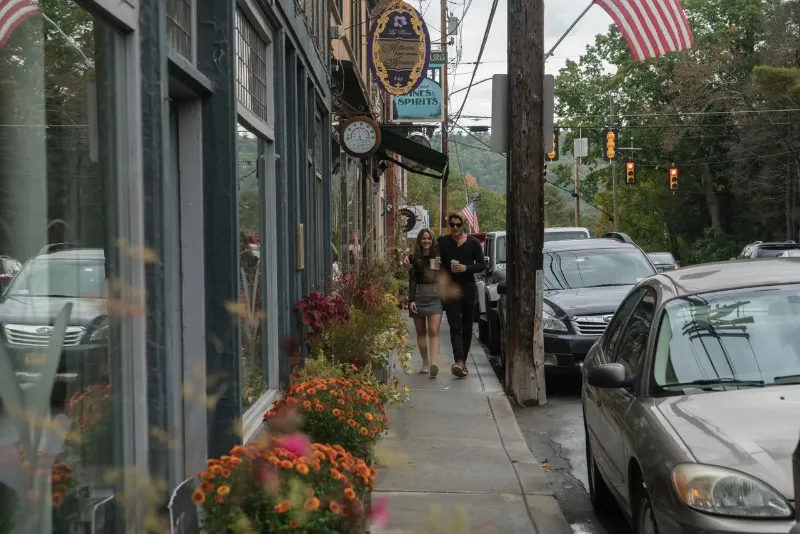 couple walking on a sidewalk 