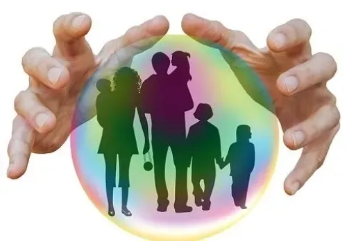 a silhouette of a family inside a crystal ball 