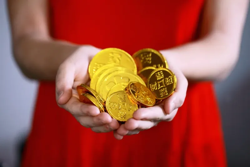 a woman with gold coins