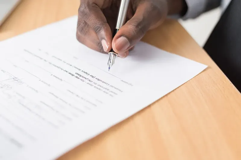 man signing a witness statement