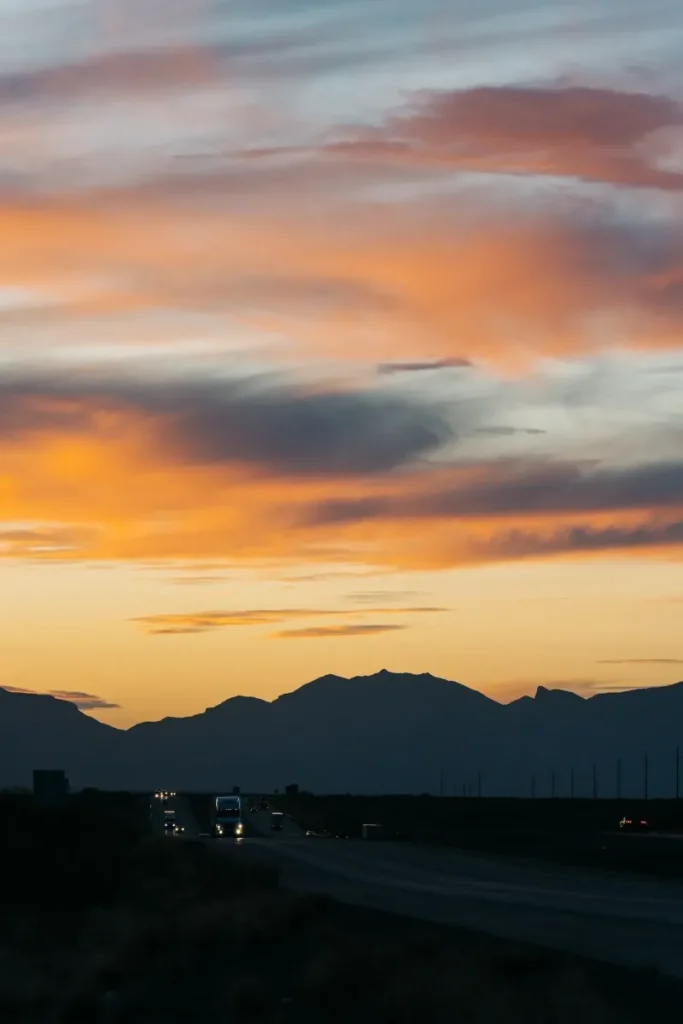 18-wheeler driving during sunset in the desert