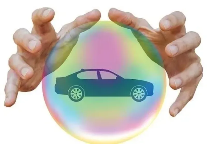 a silhouette of a car inside a crystal ball