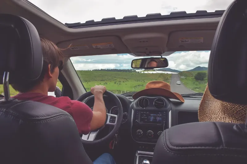 man driving in a rural area