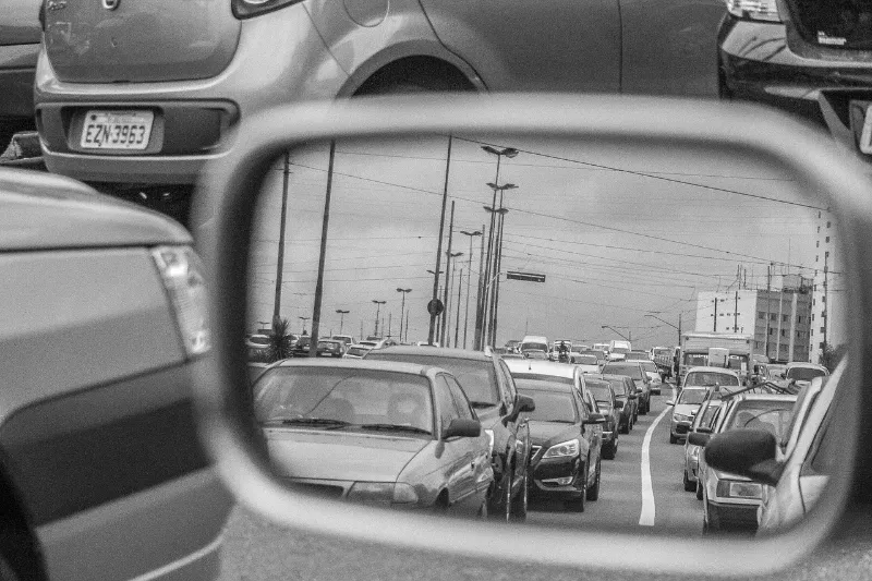 view of traffic from side mirror of a car