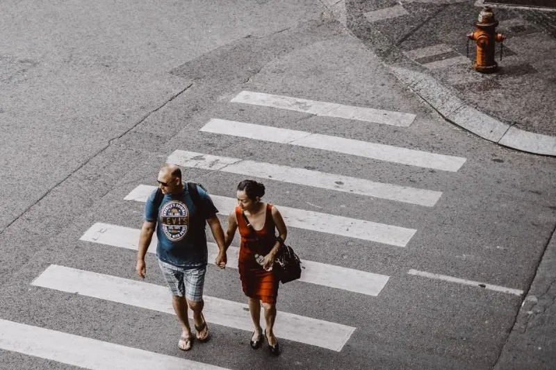 couple crossing a street